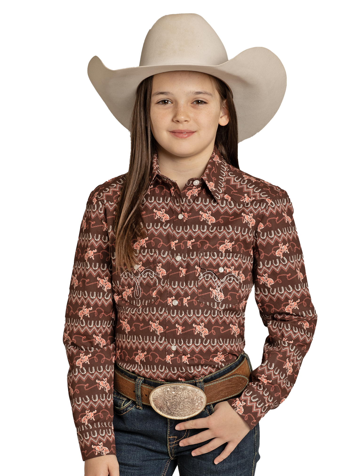 Young girl wearing a patterned brown shirt, jeans, and a beige cowboy hat on a white background