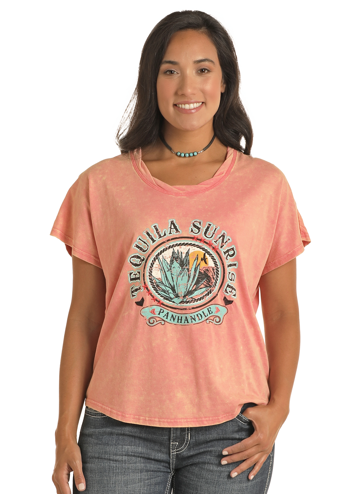 Woman wearing a pink t-shirt with a graphic design on a white background