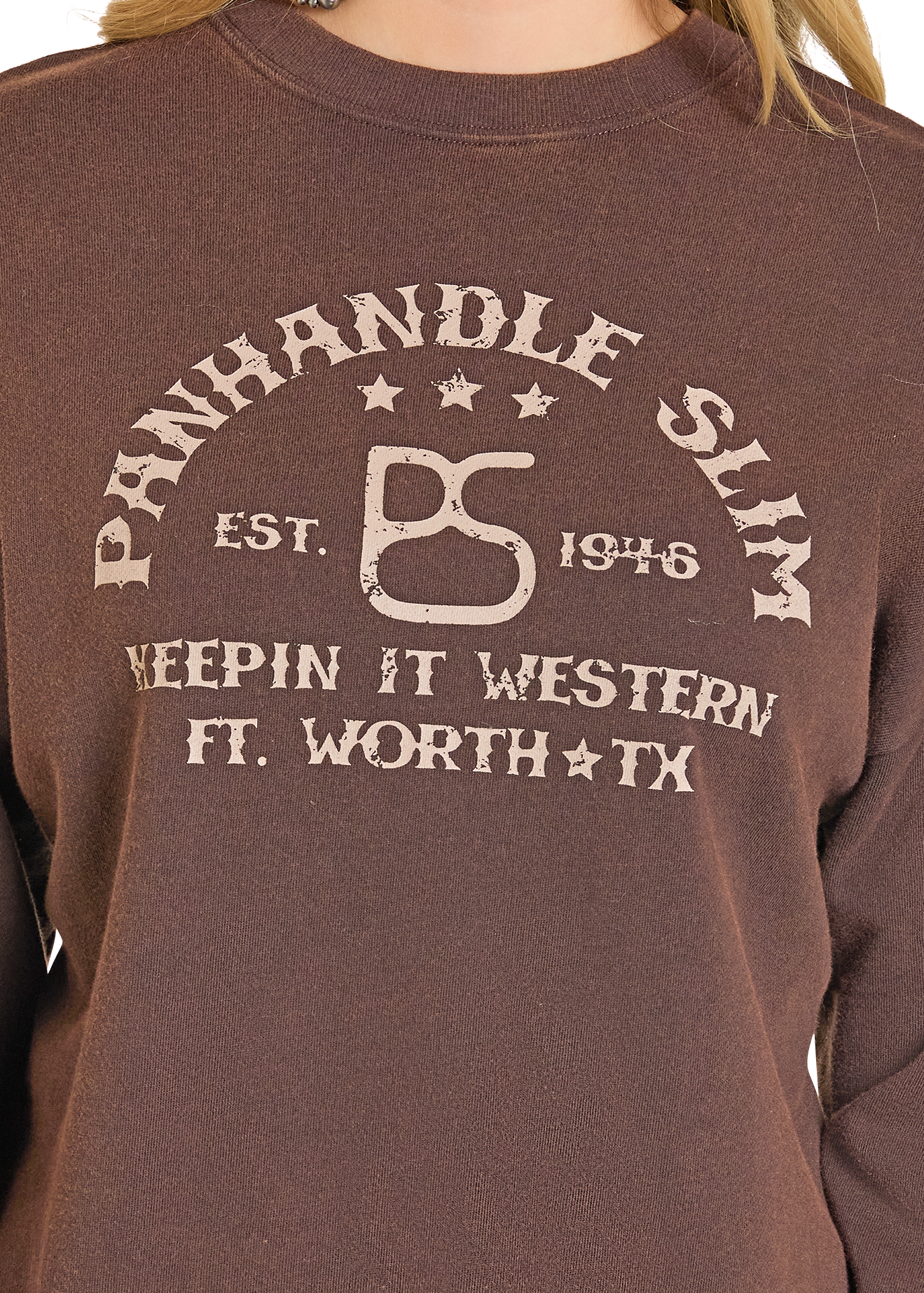 Brown sweatshirt with 'Panhandle Slim' logo and text on a person wearing it.
