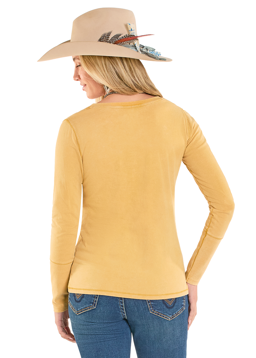 Woman wearing a yellow long-sleeve shirt and blue jeans on a white background
