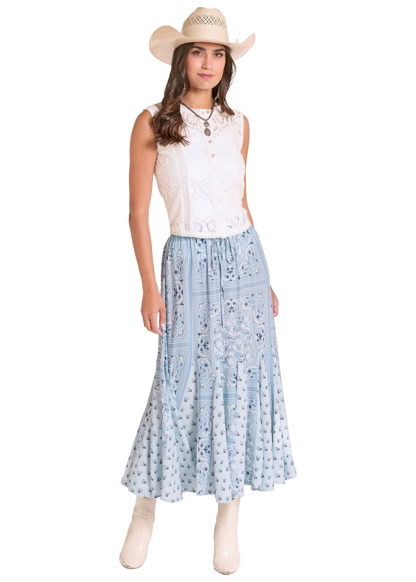Woman wearing a white sleeveless top and light blue floral skirt with a straw hat on a white background
