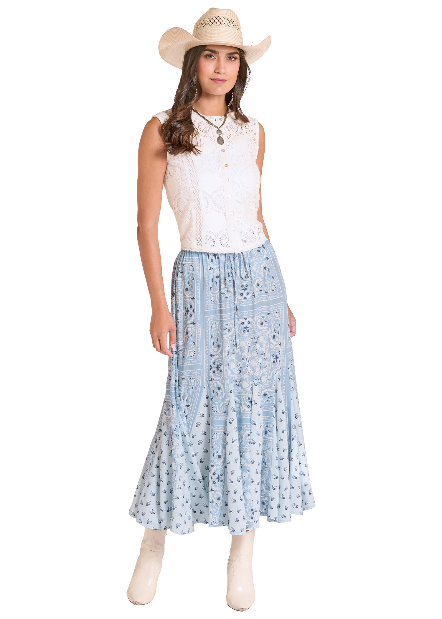 Woman wearing a white sleeveless top and light blue floral skirt with a straw hat on a white background