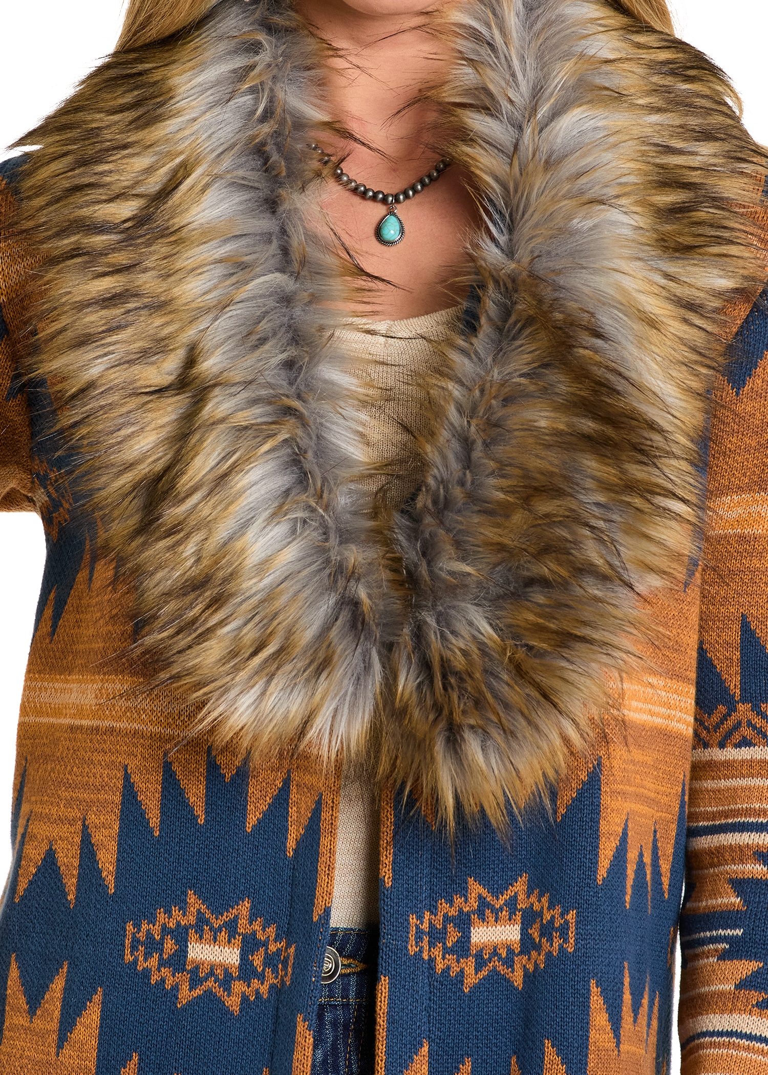 Close-up of a patterned coat with a fur collar on a white background