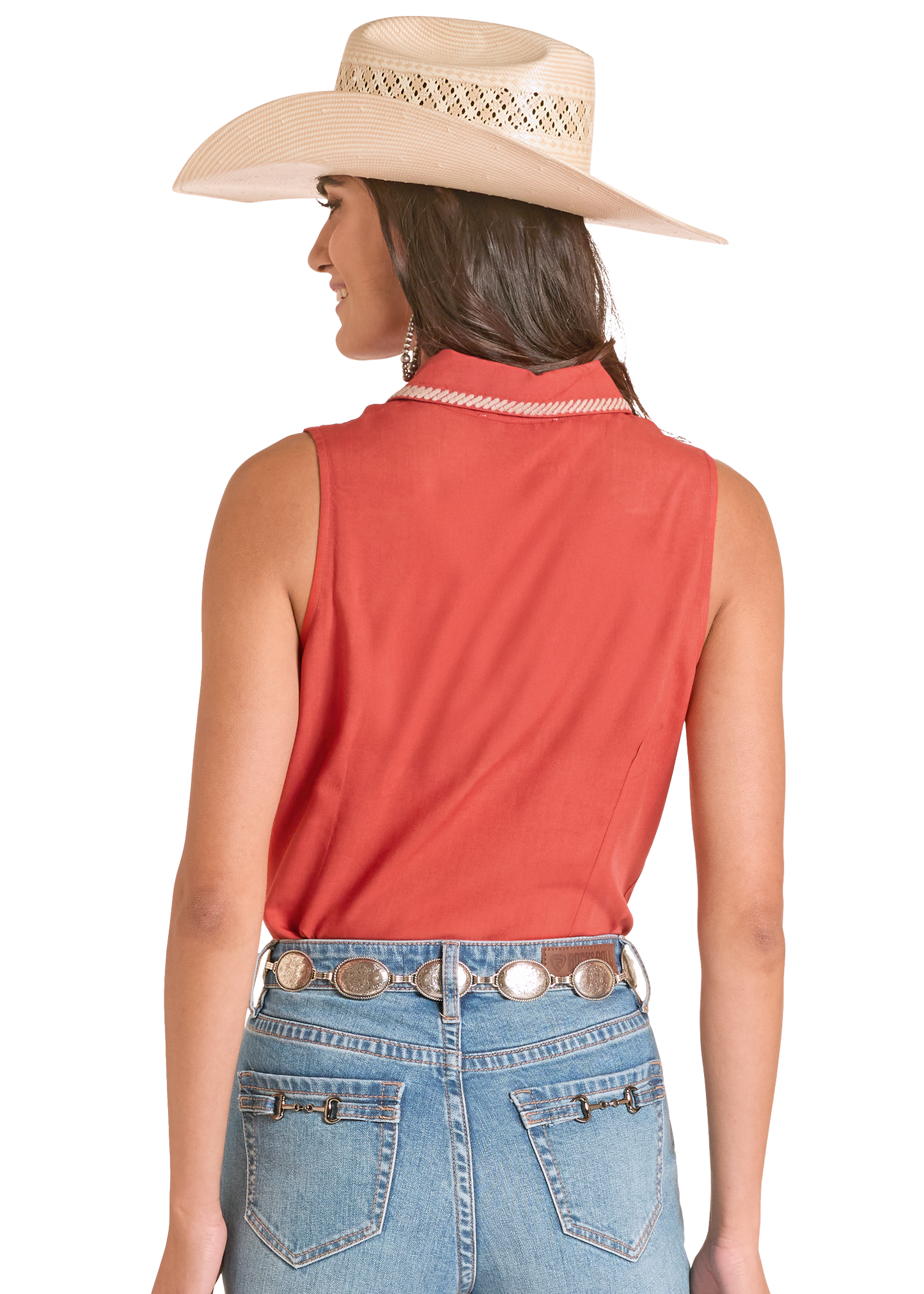 Woman wearing a red sleeveless top, blue jeans, and a beige cowboy hat on a white background