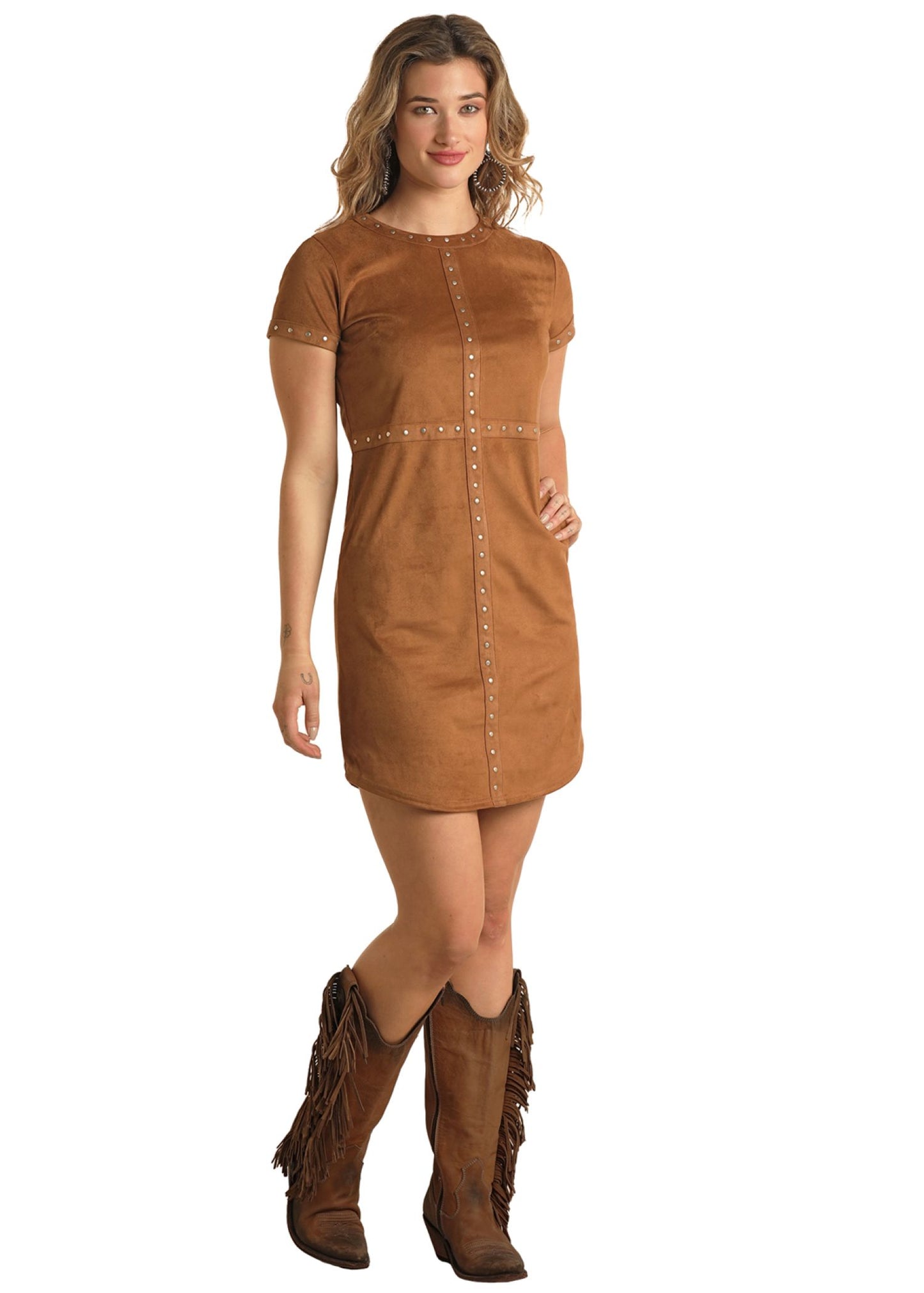 Woman wearing a brown dress and fringed boots on a white background