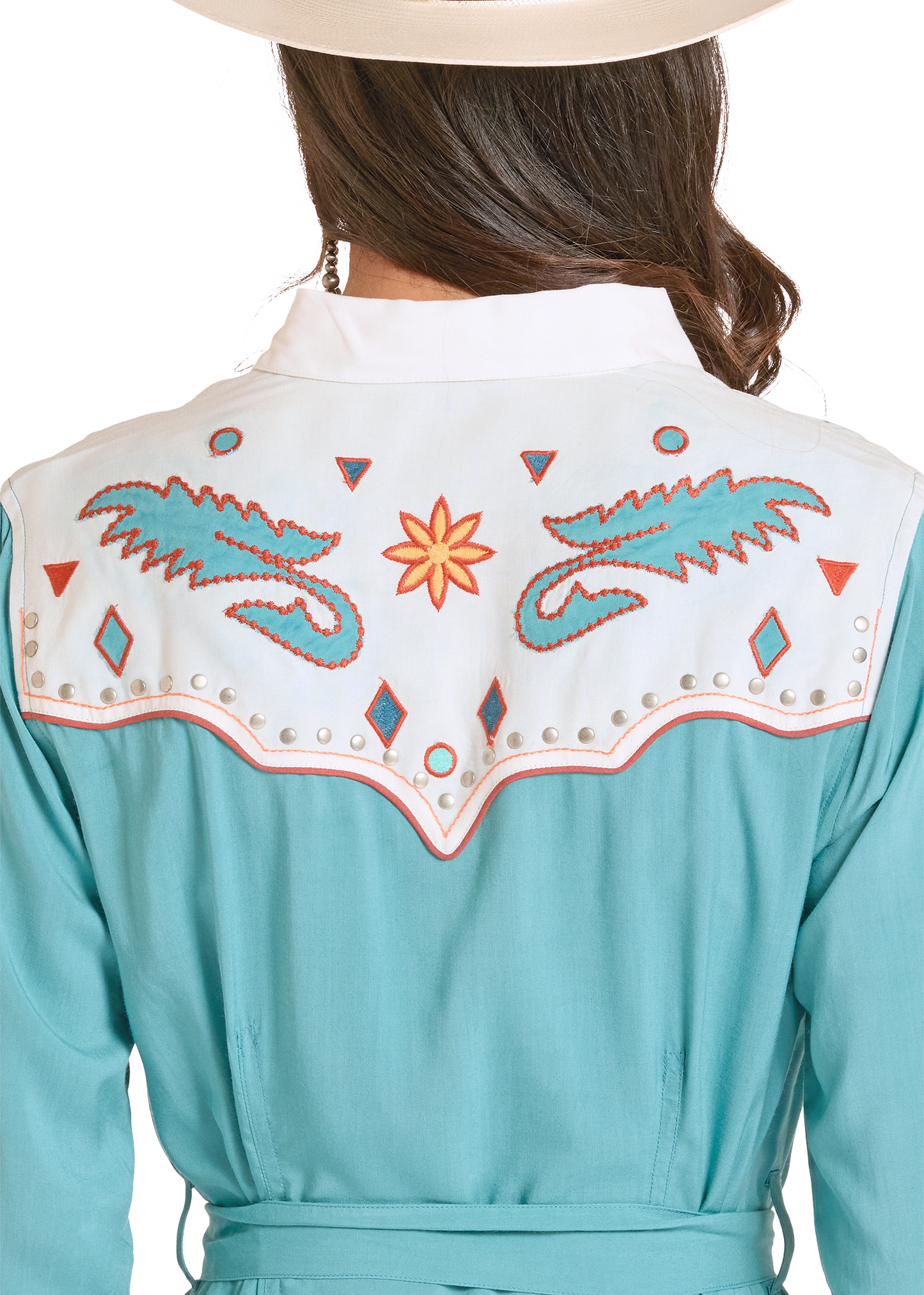 Teal dress with decorative back panel featuring patterns and a star design on a white background.