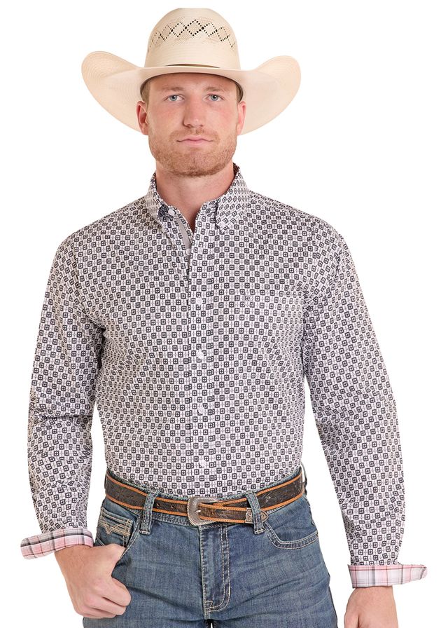 Man wearing a patterned shirt, jeans, and a cowboy hat on a white background