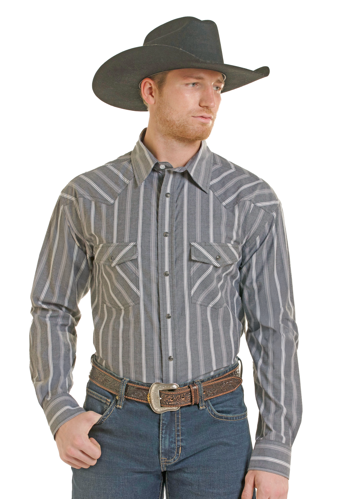 A man wearing a gray and white vertically striped western long-sleeve shirt, blue jeans, a brown leather belt, and a dark gray cowboy hat.