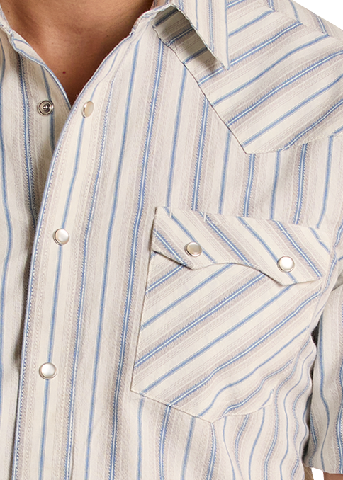 Man wearing a striped short-sleeve shirt and jeans on a white background