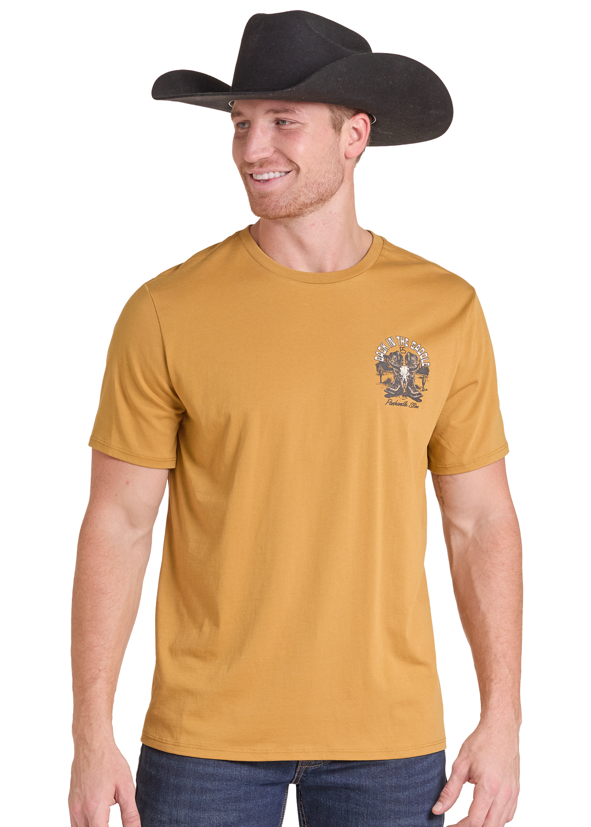 A man wearing a mustard yellow crewneck t-shirt with a small western-themed graphic on the left chest, paired with a black cowboy hat and blue jeans, set against a plain white background.