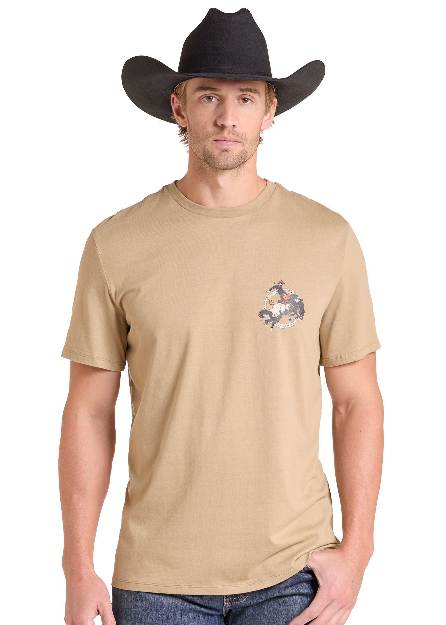 A man wearing a tan crewneck t-shirt with a small western-themed graphic on the left chest, paired with a black cowboy hat and blue jeans, set against a plain white background.