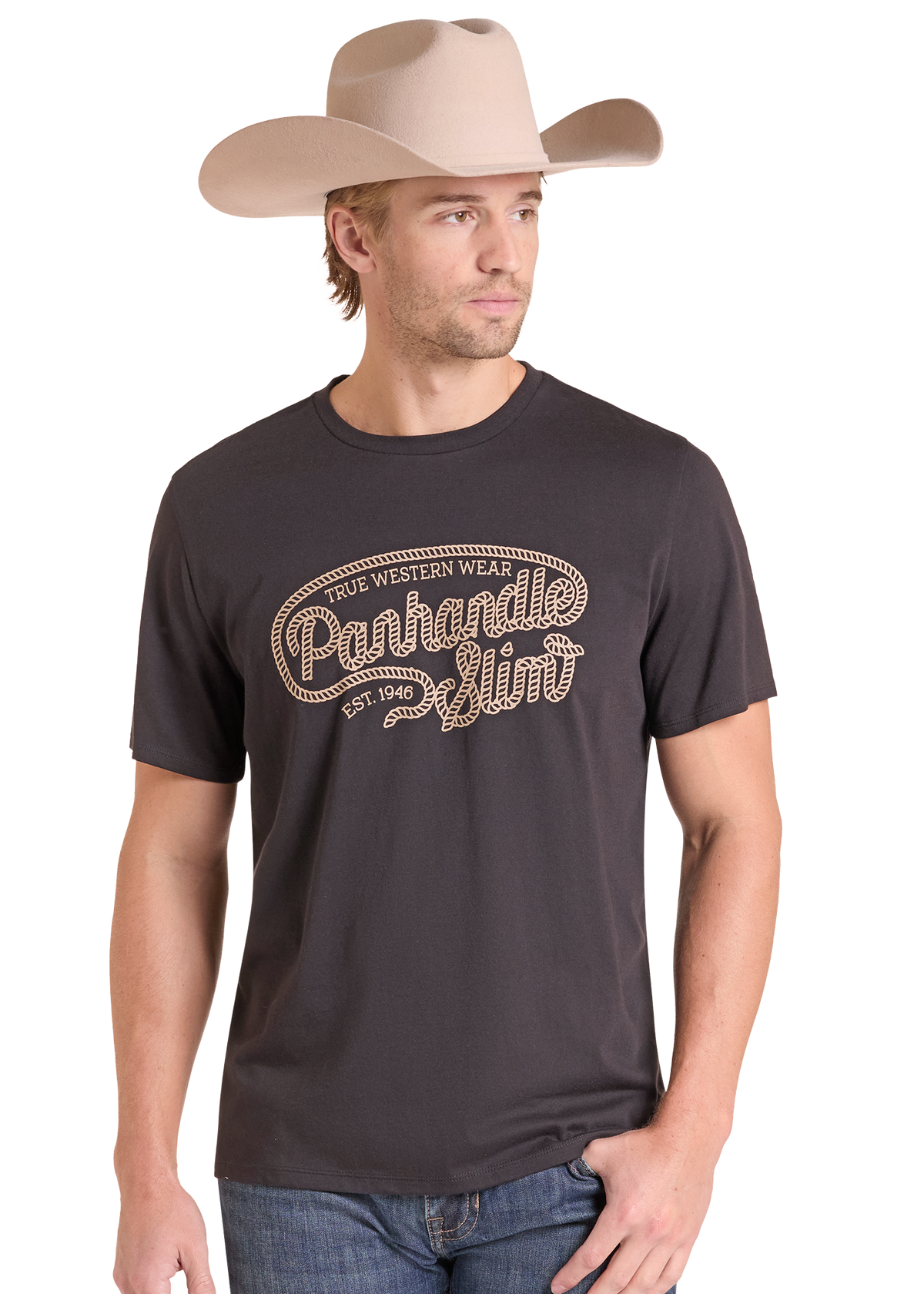 A man wearing a dark charcoal gray t-shirt with a western-style graphic that reads 'Panhandle Slim Est. 1946' in a rope font.