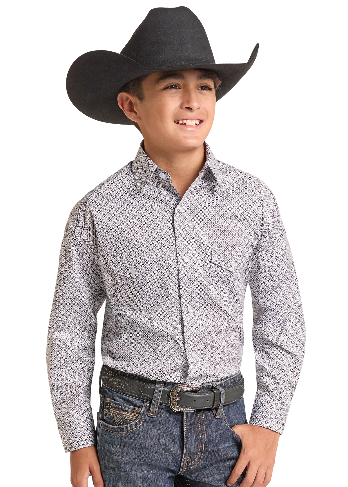 A young boy wearing a black cowboy hat, a light gray and white patterned western long-sleeve button-down shirt, and blue jeans.