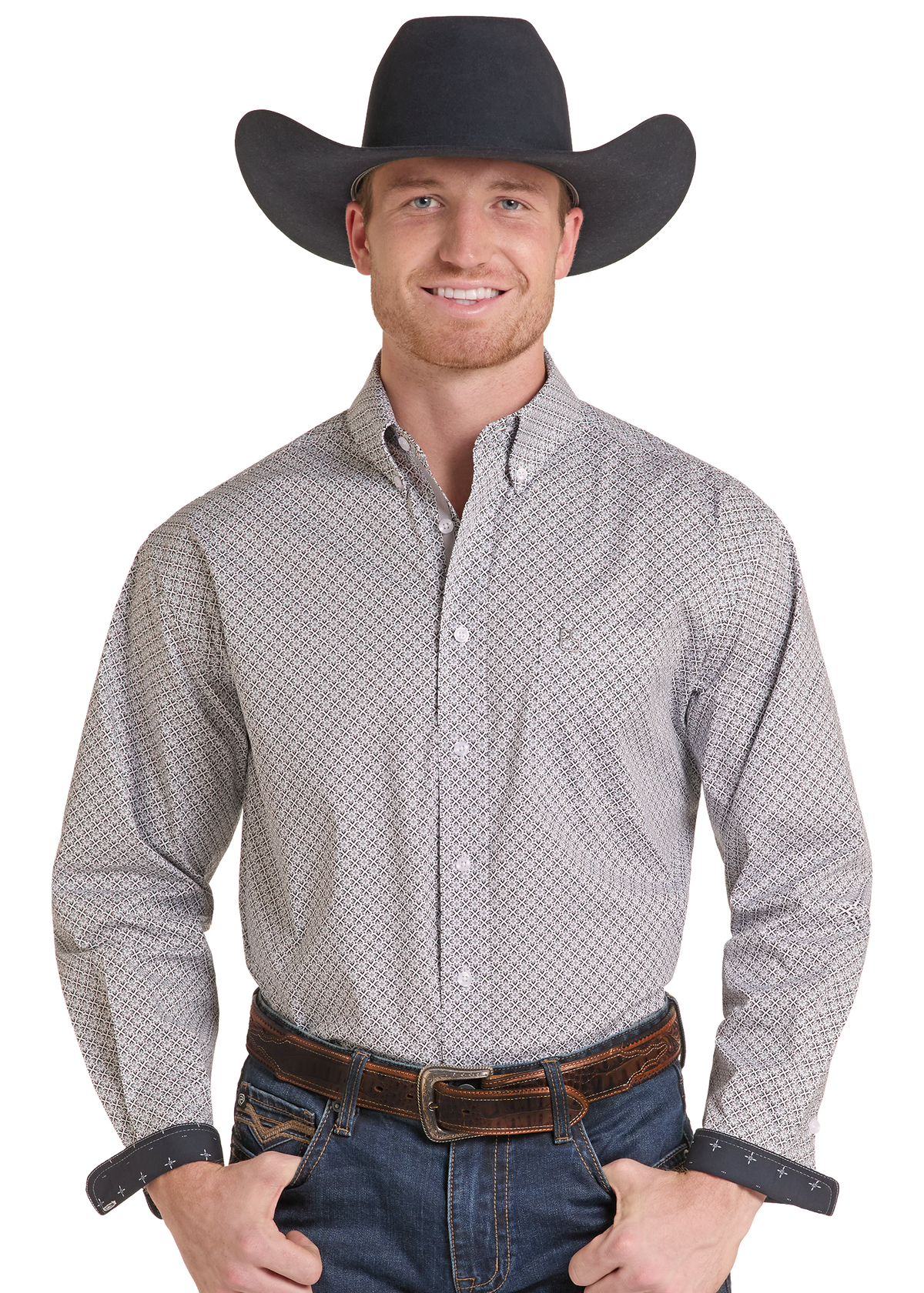 A man wearing a black cowboy hat, a light gray and white patterned western button-down shirt, a brown leather belt, and blue jeans.