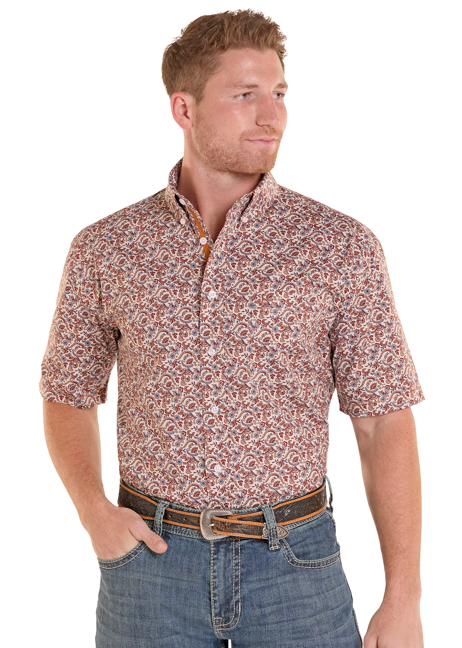 Man wearing a patterned short-sleeve shirt and jeans on a white background