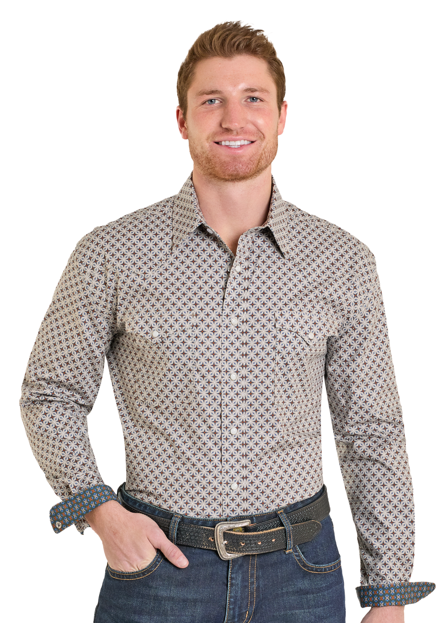 Man wearing a patterned shirt and jeans on a white background