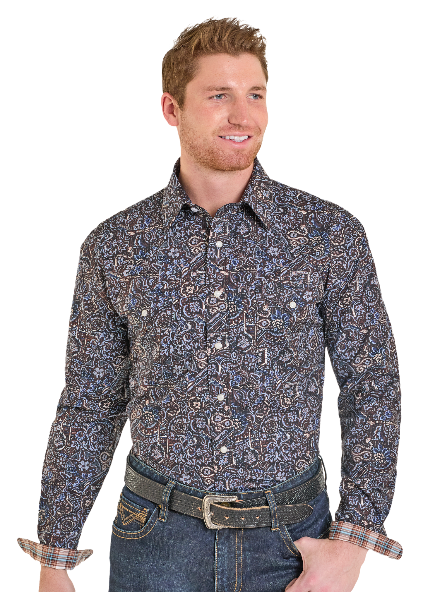 Man wearing a patterned long-sleeve shirt and jeans on a white background
