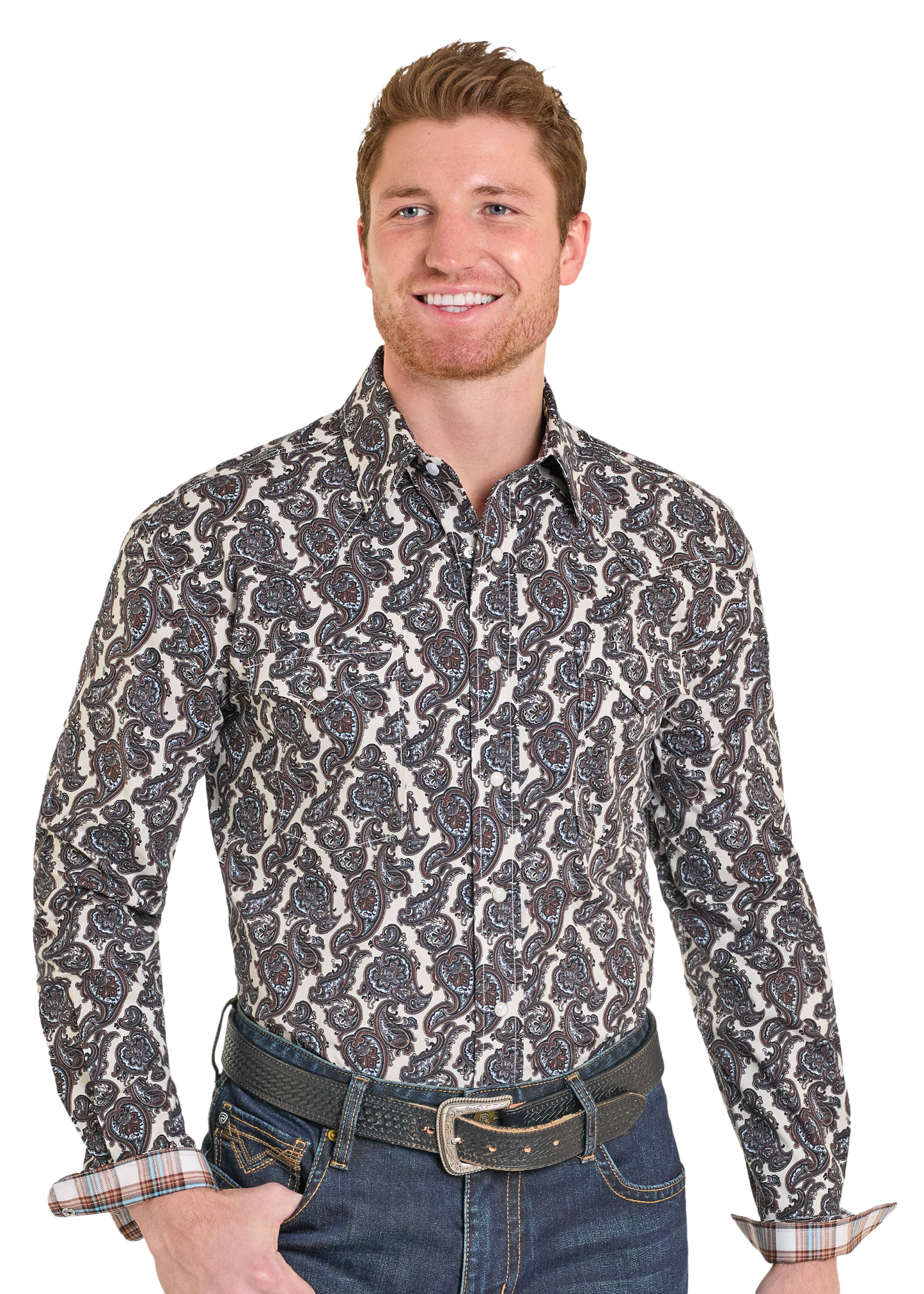 Man wearing a patterned shirt and jeans on a white background