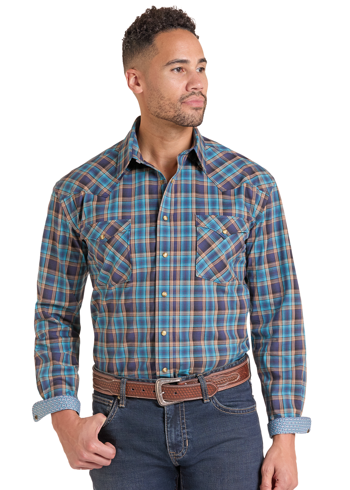A man wearing a long-sleeve western plaid button-down shirt in blue, purple, and brown, paired with a brown belt and dark blue jeans.