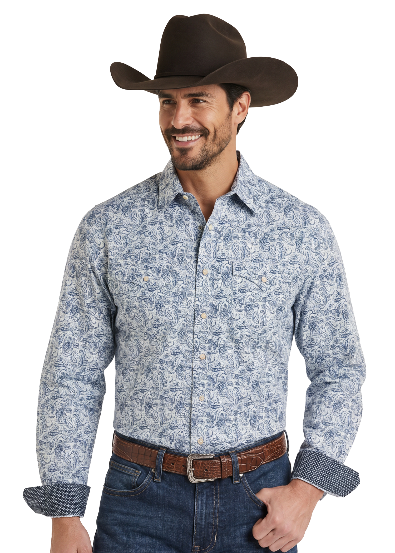 A man wearing a light blue and white paisley western long-sleeve button-down shirt, a brown cowboy hat, and a brown leather belt.