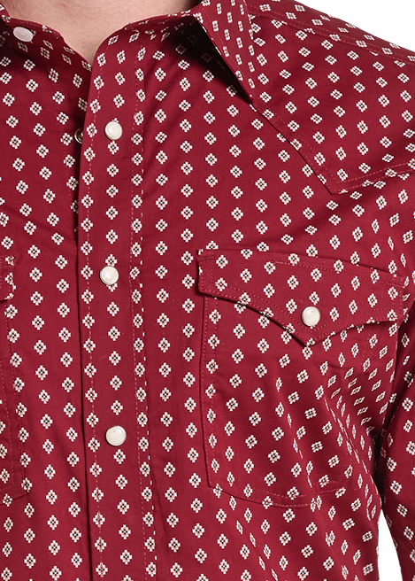 close up of  a red western long-sleeve button-up shirt with a white geometric pattern.
