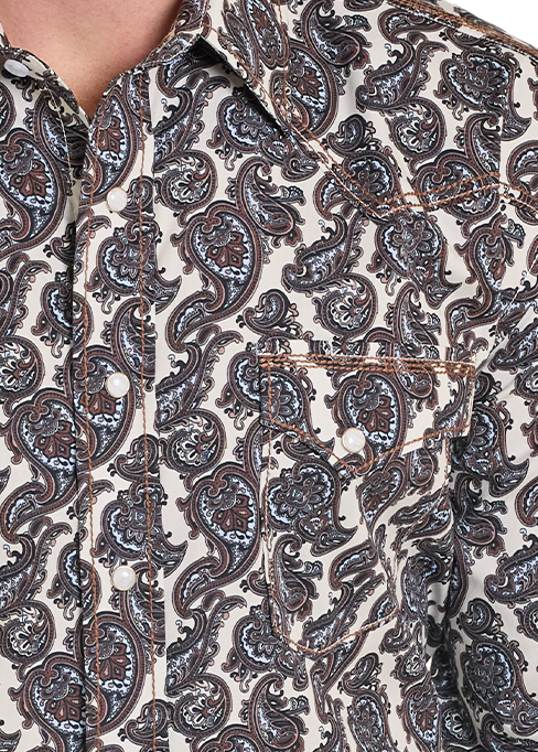 Man wearing a patterned shirt and cowboy hat on a white background