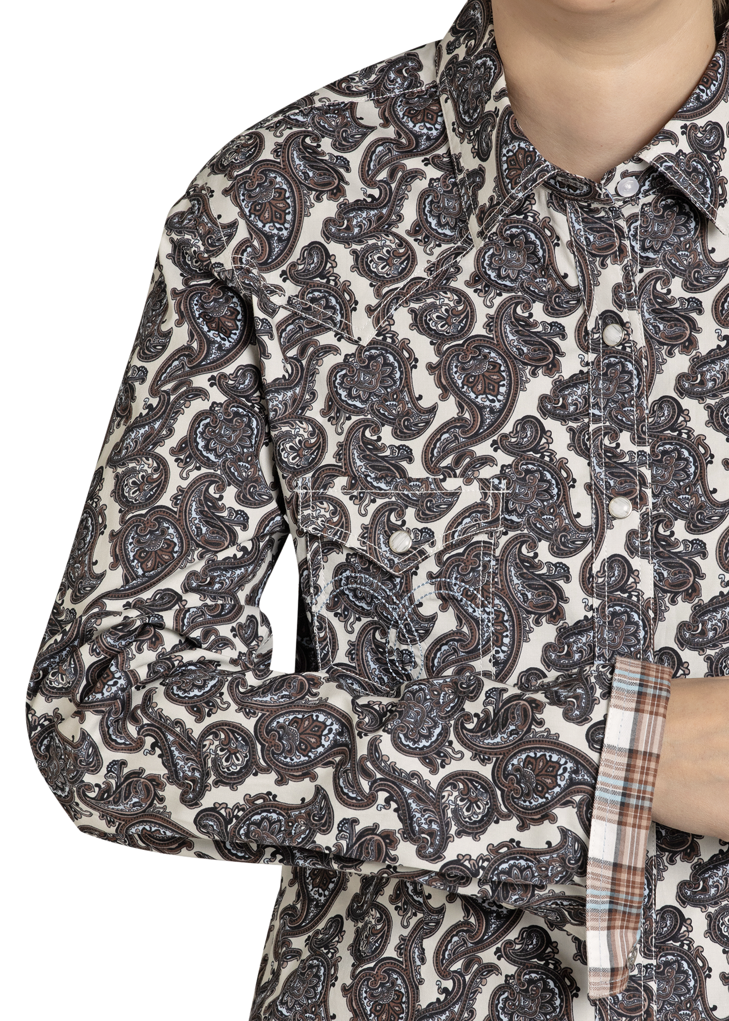 Close-up of a person wearing a patterned shirt with a white background