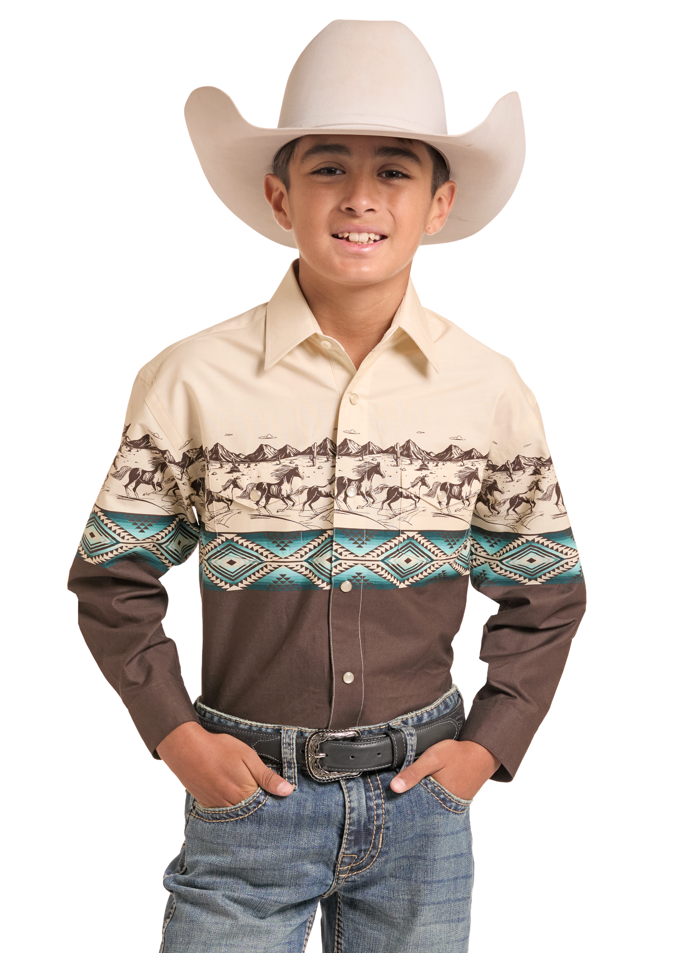 A young boy wearing a long-sleeve western shirt with a horse pattern across the chest and upper sleeves, paired with a beige cowboy hat, jeans, and a black belt.
