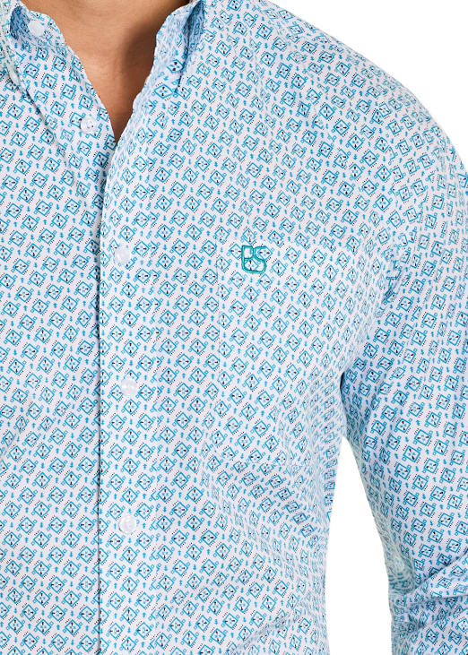 Man wearing a light blue patterned shirt and jeans on a white background