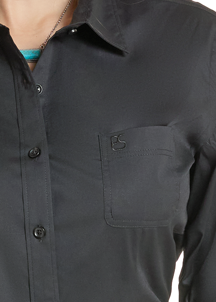 Detail pocket on a women's black button up shirt.