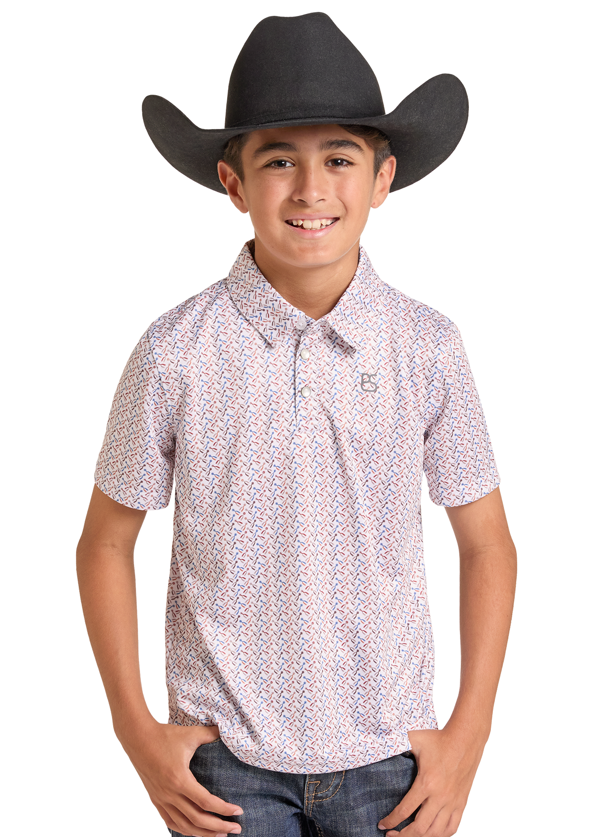 A young boy wearing a black cowboy hat, a short-sleeve button-up shirt with a small geometric pattern in pink, blue, and white, and blue jeans.