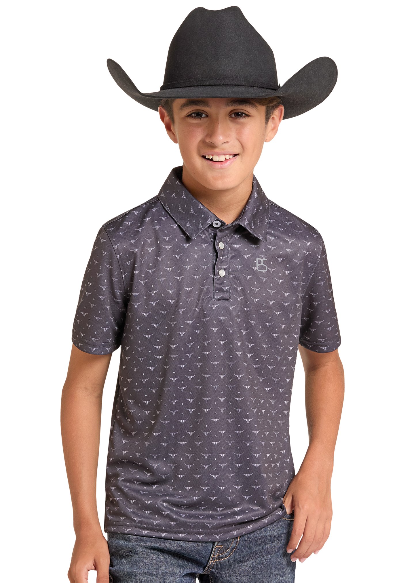 A young boy wearing a dark gray patterned polo shirt and a black cowboy hat, standing against a plain white background.