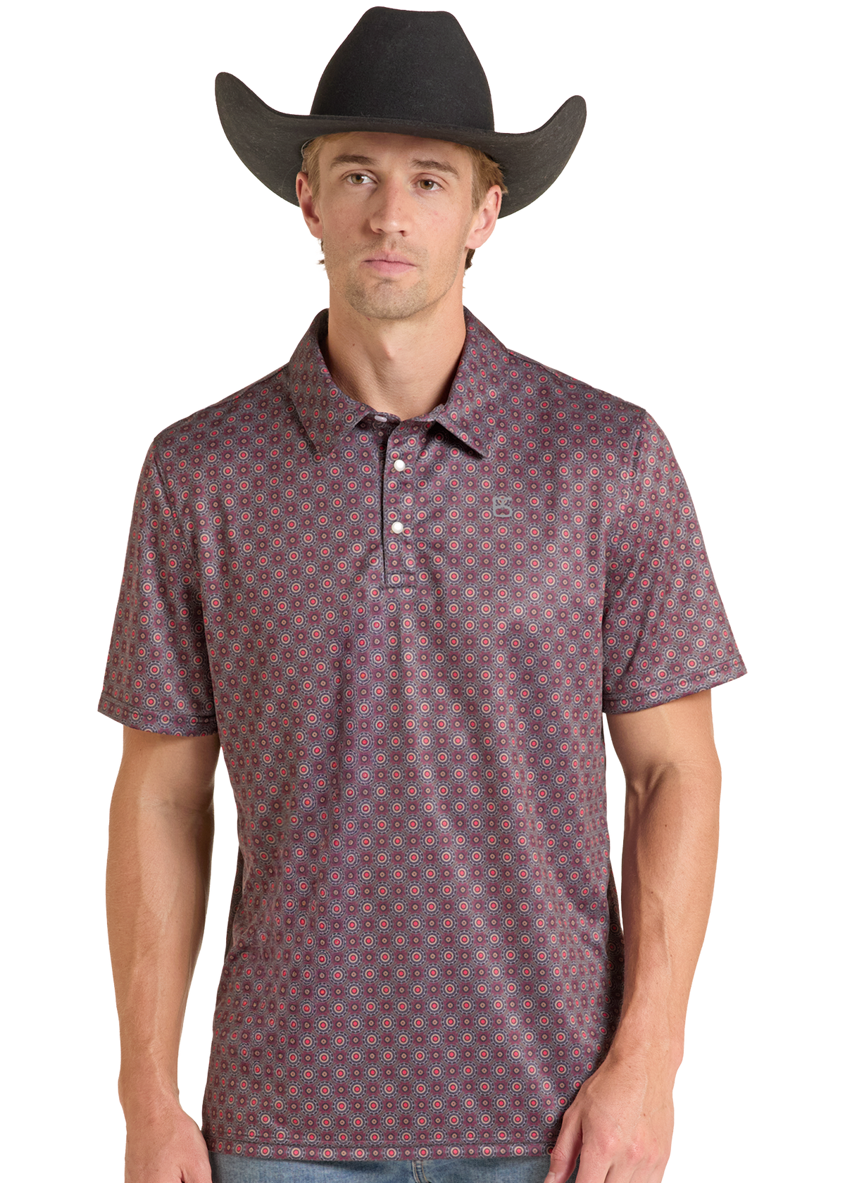 A man wearing a black cowboy hat and a short-sleeve button-up polo shirt with a small geometric pattern in muted red, blue, and brown tones. The photo is taken against a clean white background.