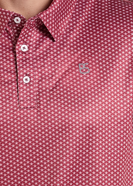 Closeup of a red short-sleeve polo shirt with a white micro-dot pattern.
