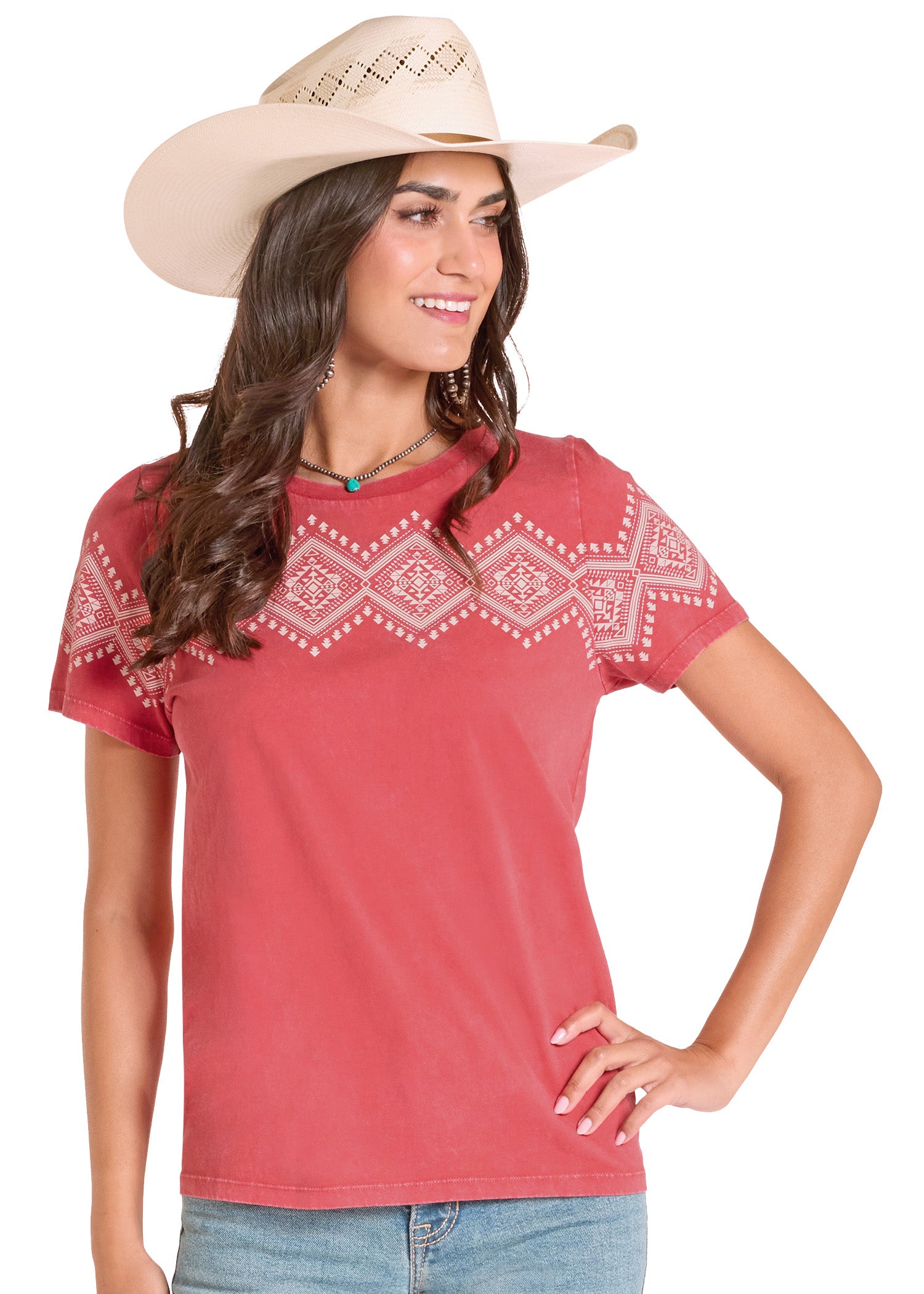 Woman wearing a red embroidered shirt and beige cowboy hat on a white background