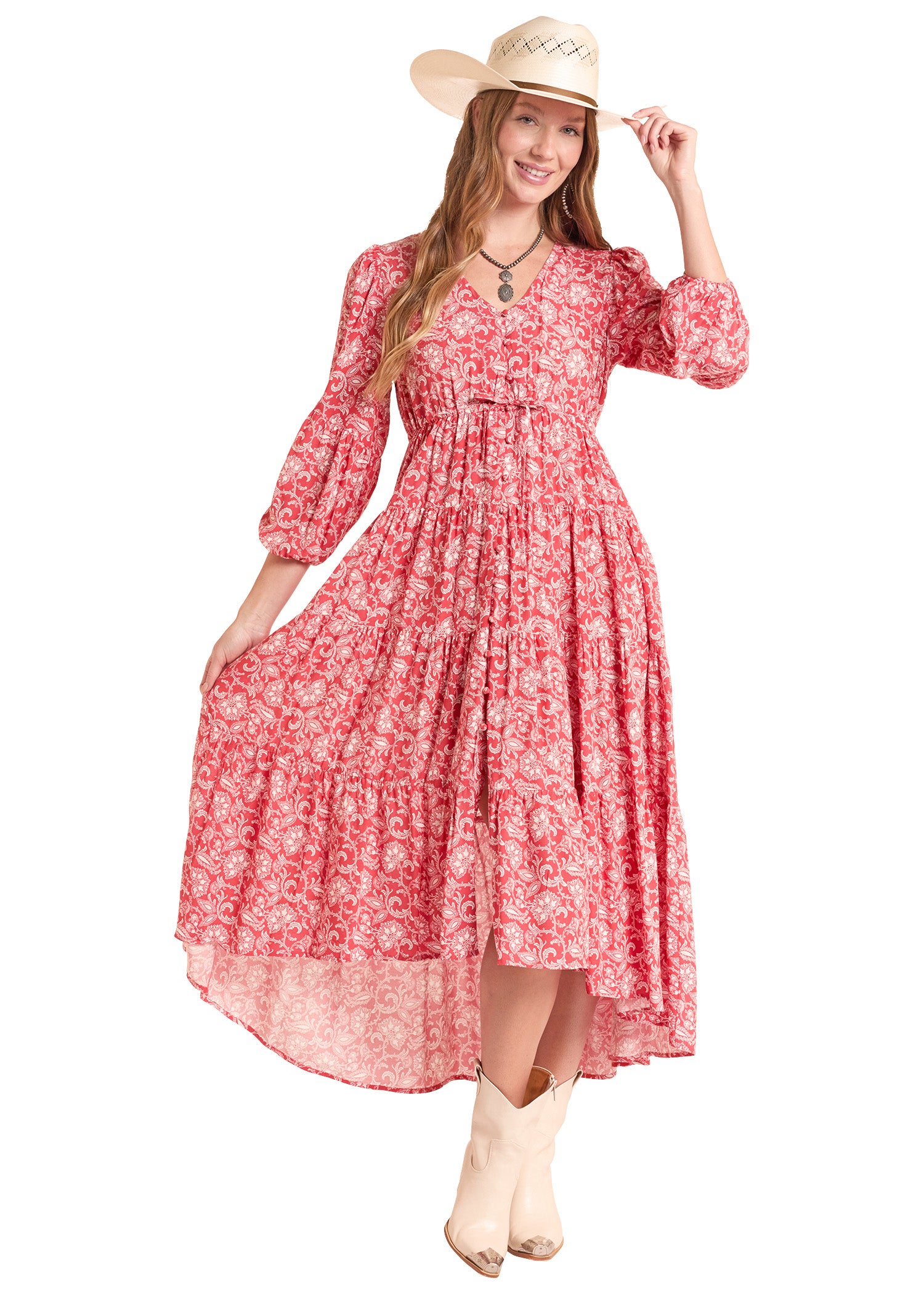 Woman wearing a red floral dress and cowboy hat on a white background