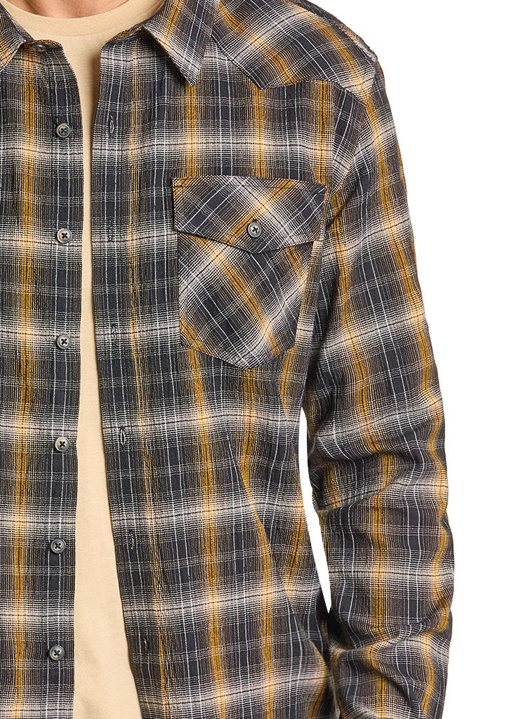 Man wearing a black cowboy hat and plaid shirt on a white background