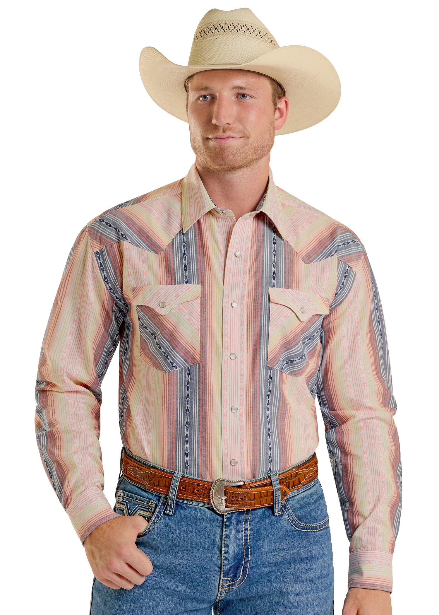 Man wearing a patterned western shirt, jeans, and a cowboy hat on a white background