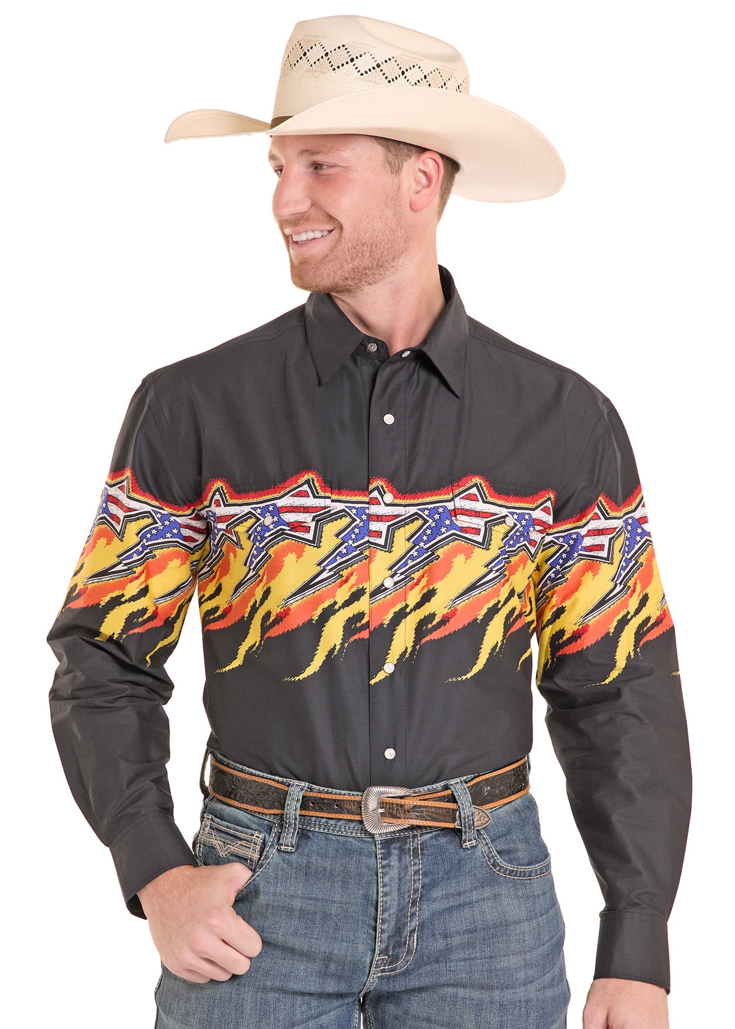 Man wearing a black shirt with colorful designs, jeans, and a cowboy hat on a white background