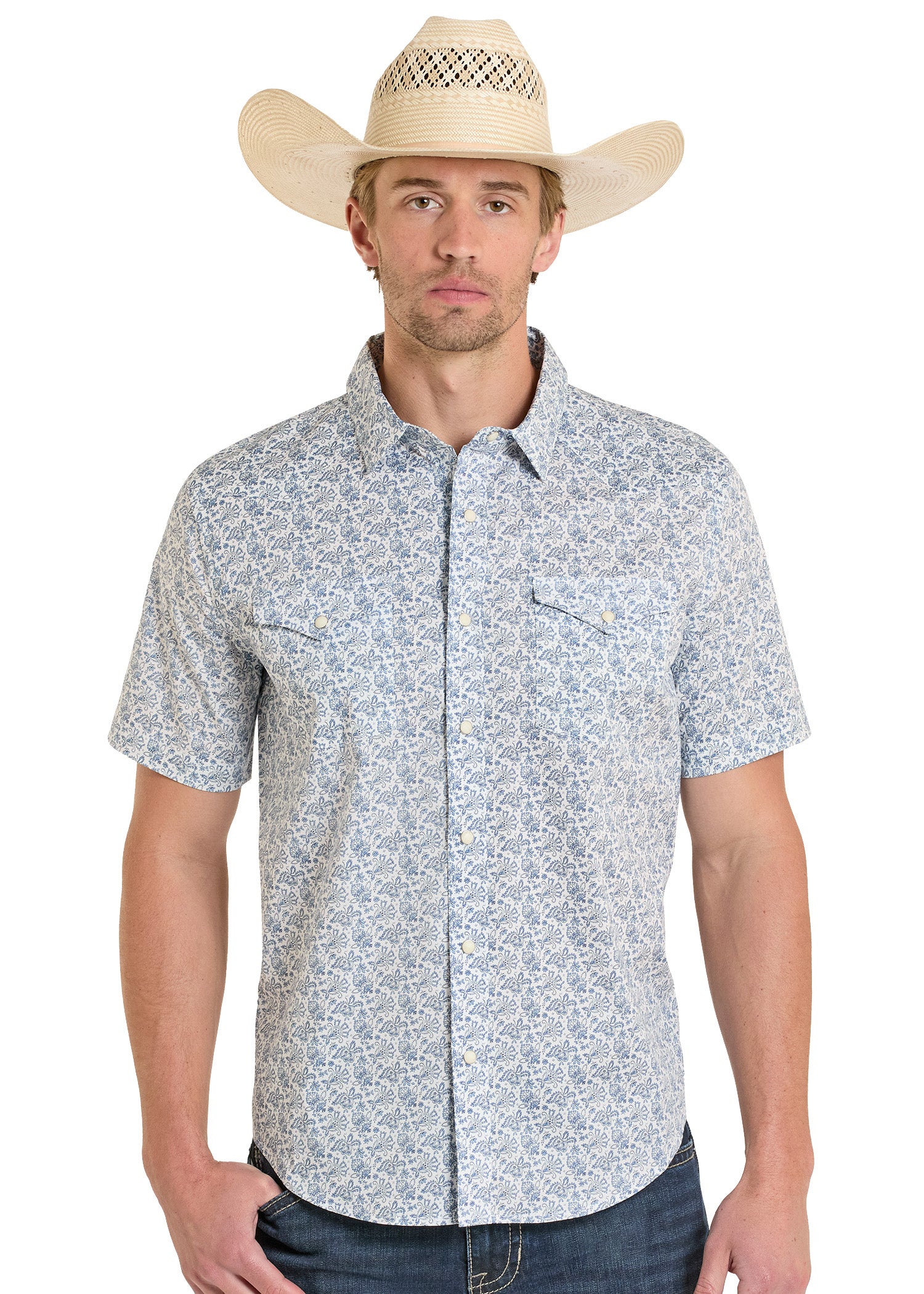 Man wearing a patterned short-sleeve shirt and cowboy hat on a white background
