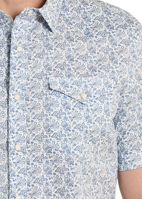 Close up of a patterned short-sleeve shirt on a white background