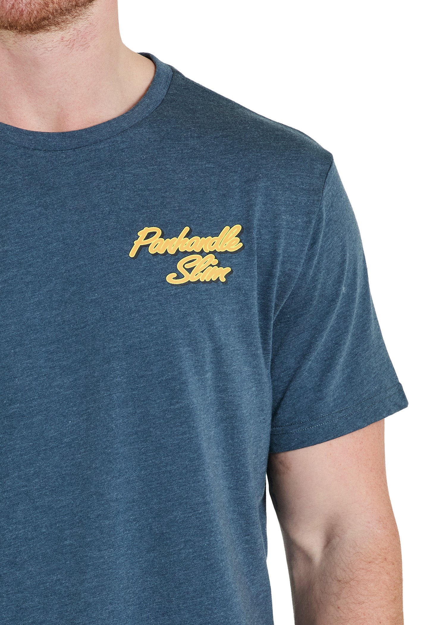 Blue t-shirt with gold logo worn by a person on a white background