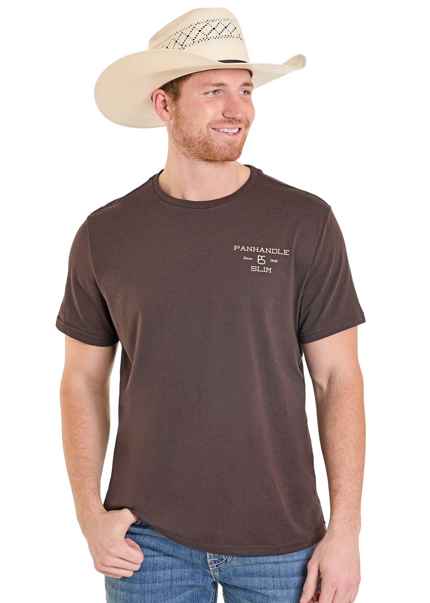 Man wearing a brown t-shirt with a logo and a beige cowboy hat on a white background