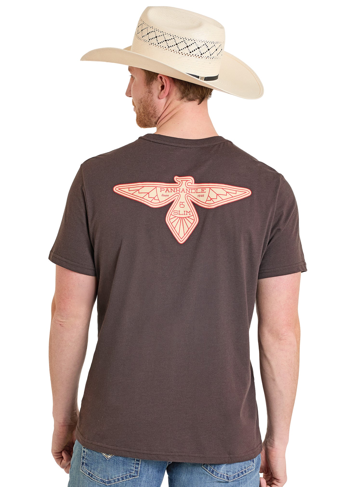 Man wearing a brown t-shirt with a red eagle design on the back, standing against a white background.
