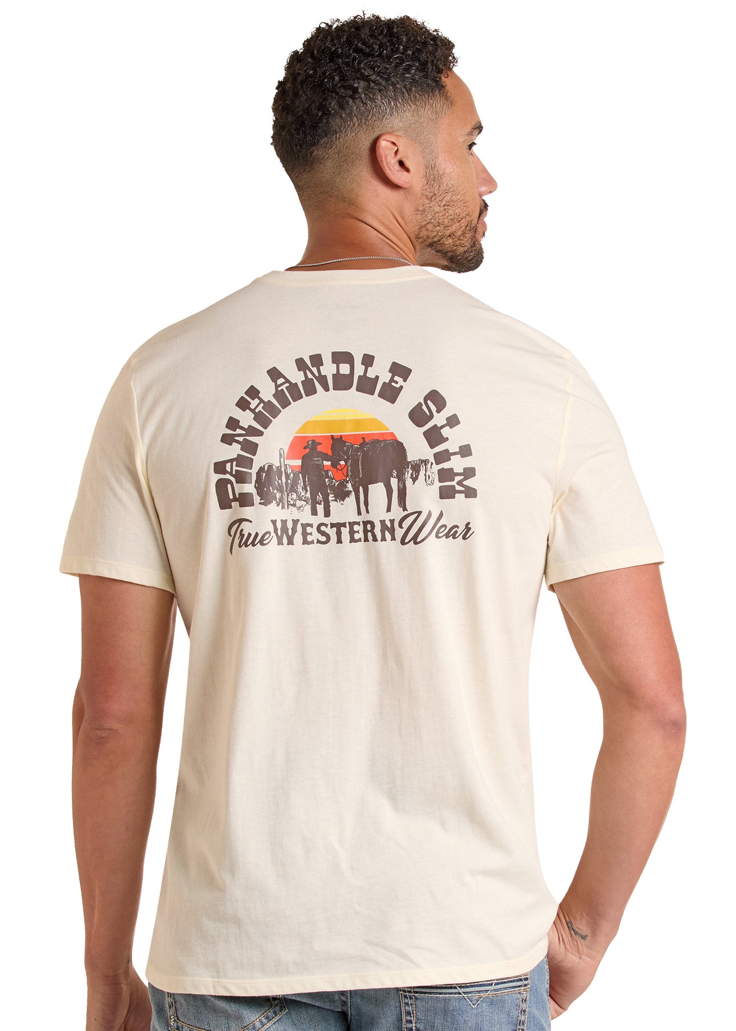 Man wearing a beige t-shirt with a graphic design on the back, standing against a white background.