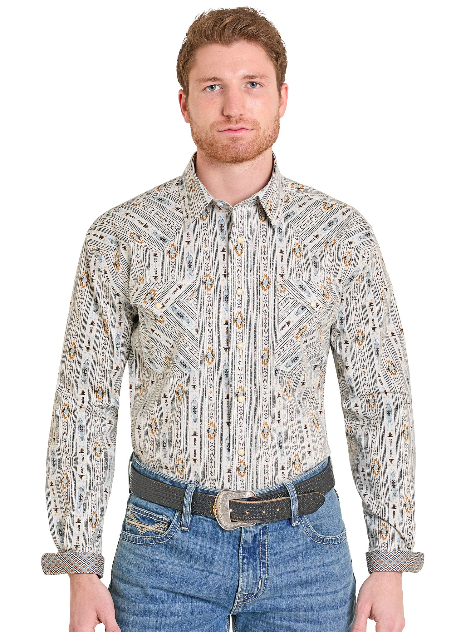 Man wearing a printed western shirt and blue jeans. 