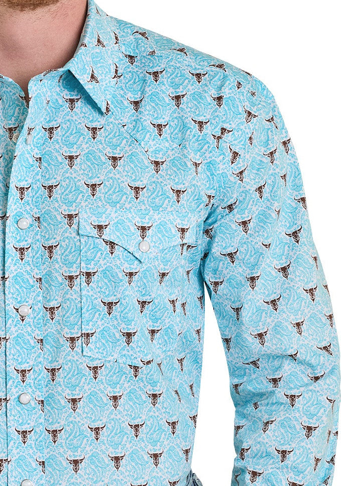 Man wearing a light blue patterned shirt with rolled-up sleeves, blue jeans, and a beige cowboy hat on a white background.