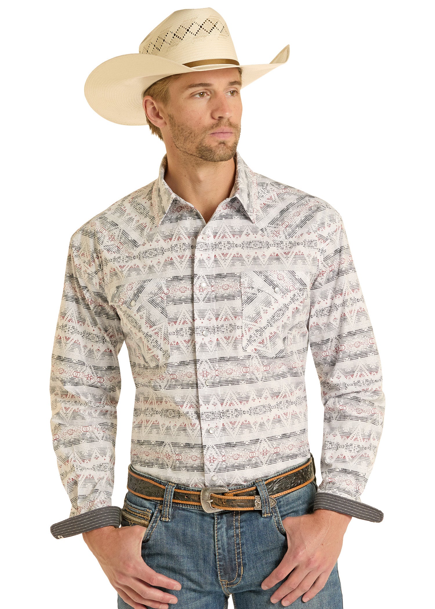 Man wearing a patterned long-sleeve shirt, jeans, and a cowboy hat on a white background