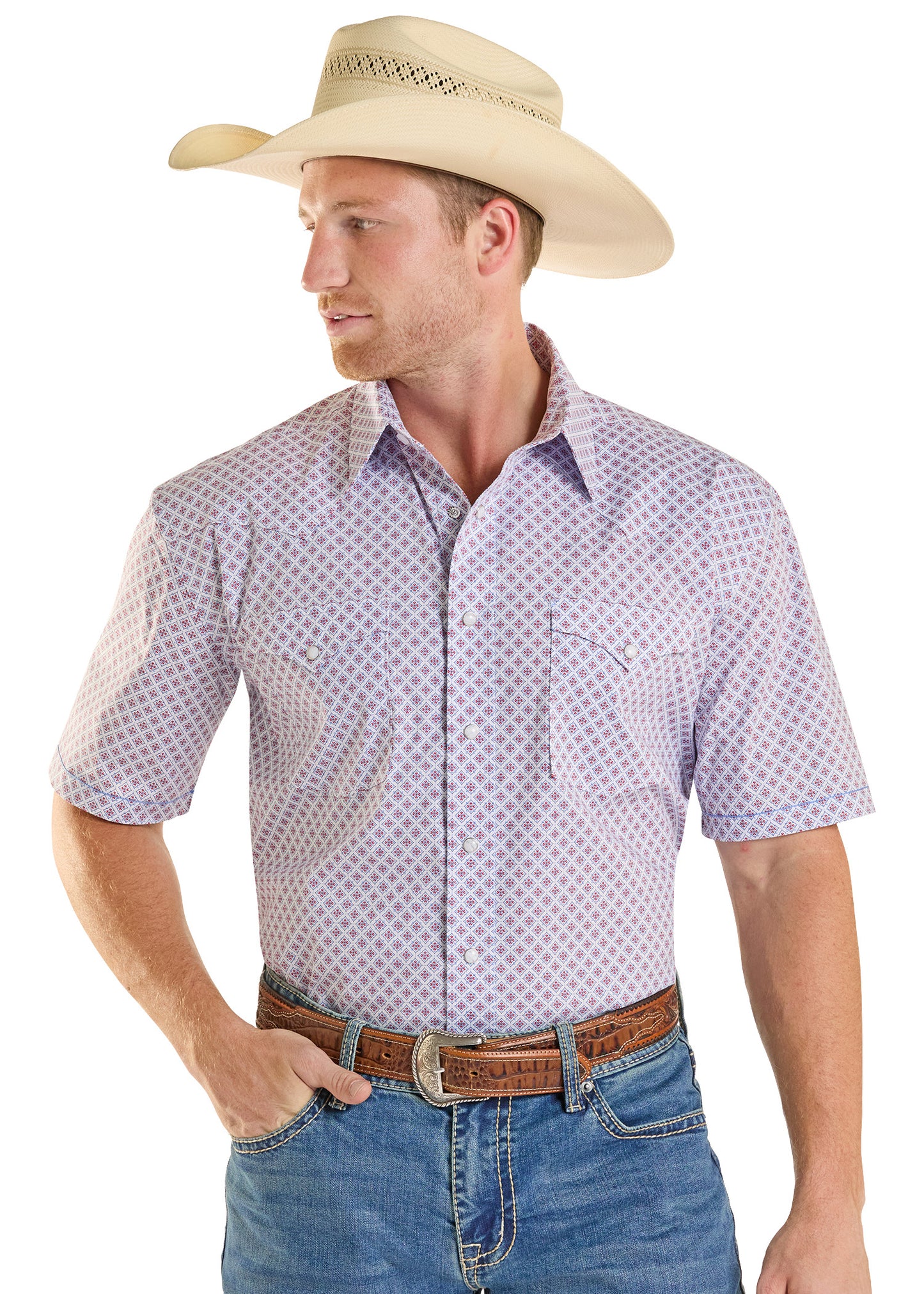 Man wearing a patterned short-sleeve shirt, blue jeans, and a beige cowboy hat on a white background