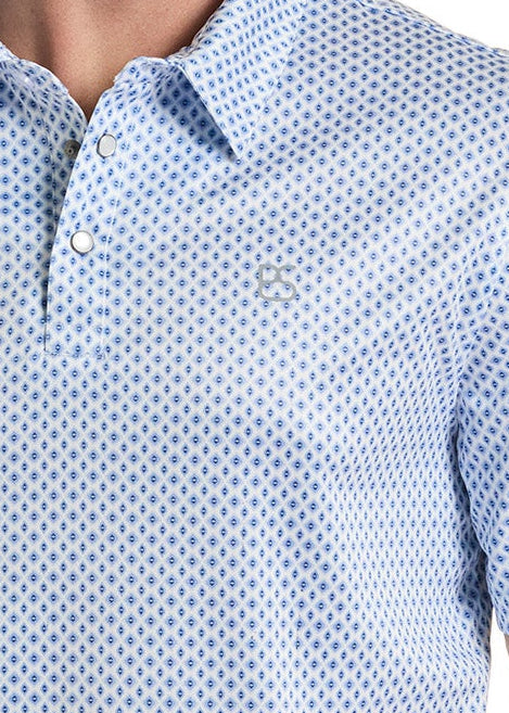 Man wearing a blue patterned shirt and beige cowboy hat on a white background
